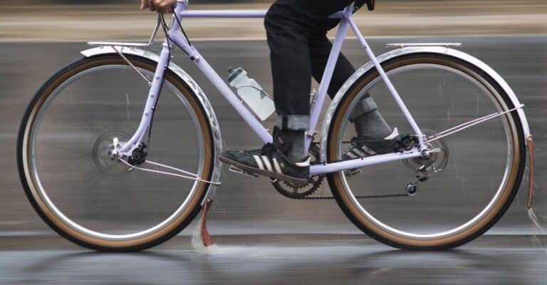 A road bicycle with full-coverage fenders for protection from road spray